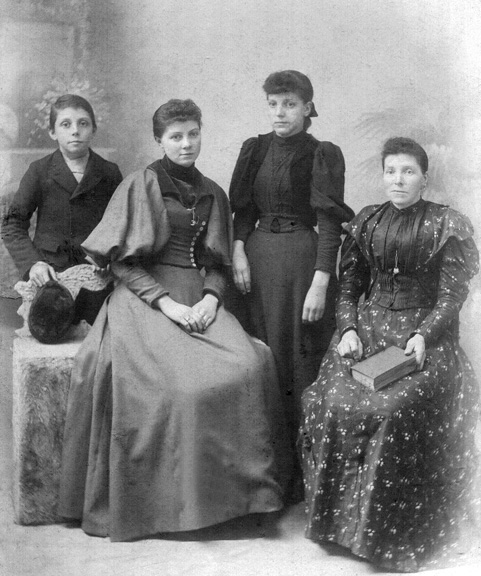 John with sisters and mother