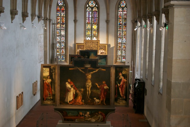 Colmar: Unterlinden Museum -- the Isenheim altarpiece, disassembled to show the several sets of painted doors which can be opened to reveal the wooden sculptures behind